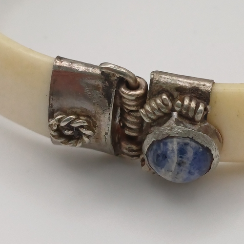 100 - Here we have a Bone Hinged Bangle with Cabochon Kyanite Blue Stones set in.  This is unusual Bangle ... 