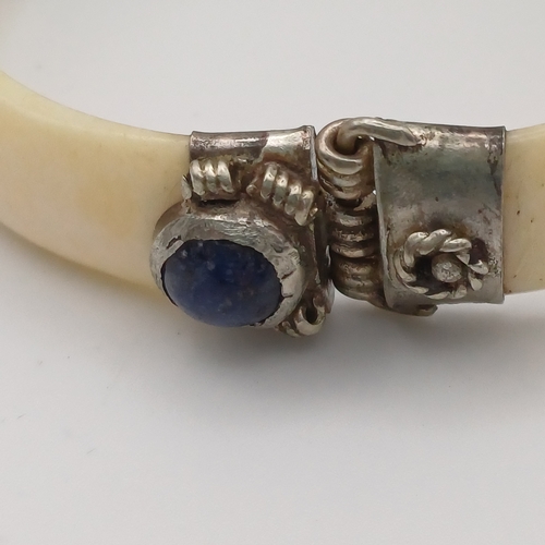 100 - Here we have a Bone Hinged Bangle with Cabochon Kyanite Blue Stones set in.  This is unusual Bangle ... 