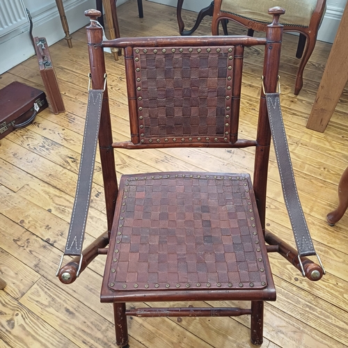 21 - Here we have a Campaign Chair in dark wood with leather back, seat and arms.  This is a really comfo... 