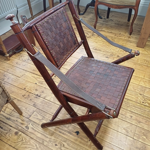 21 - Here we have a Campaign Chair in dark wood with leather back, seat and arms.  This is a really comfo... 