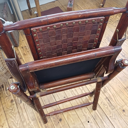 21 - Here we have a Campaign Chair in dark wood with leather back, seat and arms.  This is a really comfo... 