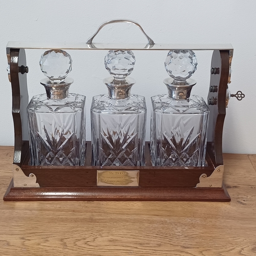 23 - This is a really stunning Three Decanter Tantalus.  This in excellent condition and comes with key w... 