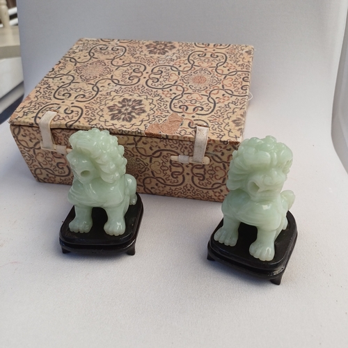 44 - Chinese Hand Carved Jade Lions with wooden stands which comes with their travel box which itself has... 