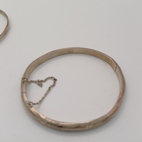 124 - Six Silver Bangles:
- 4 x hinged
- 1 slip on 
- 1 x expanding

All are marked either 925 or are hall... 