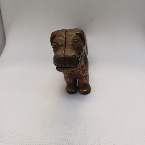 64 - 1940's Nutcracker in the shape of a dog, so when you lift his tail he opens his mouth and you push i... 