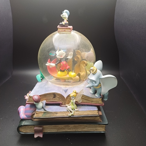 101 - A lovely Snow Globe with mixed characters including Micky Mouse, Dumbo, Little Mermaid.  The fiber o... 