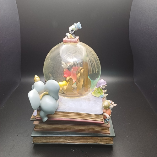 101 - A lovely Snow Globe with mixed characters including Micky Mouse, Dumbo, Little Mermaid.  The fiber o... 