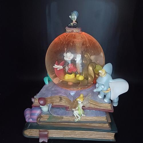 101 - A lovely Snow Globe with mixed characters including Micky Mouse, Dumbo, Little Mermaid.  The fiber o... 