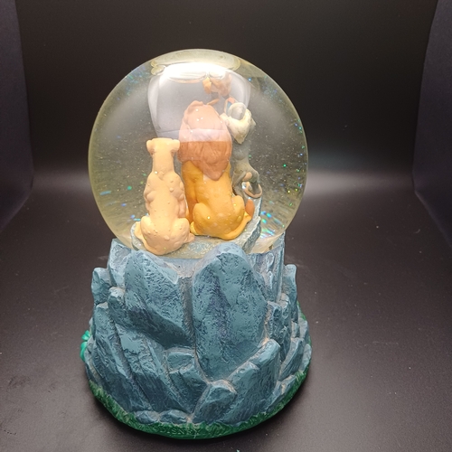 104 - Disney's 'Lion King' snow globe sitting on 'Pride Rock' which is also a music box playing 'Circle of... 