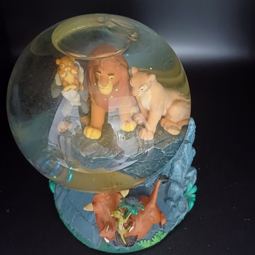 104 - Disney's 'Lion King' snow globe sitting on 'Pride Rock' which is also a music box playing 'Circle of... 