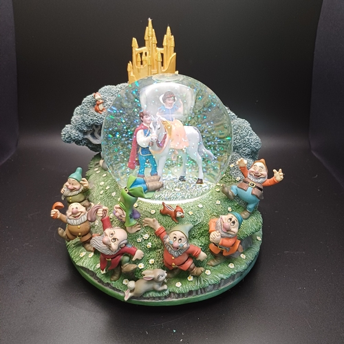 105 - Disney's 'Snow White and the Seven Dwarfs' Snow Globe with Snow White with Prince Charming and all t... 