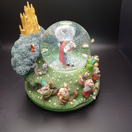 105 - Disney's 'Snow White and the Seven Dwarfs' Snow Globe with Snow White with Prince Charming and all t... 