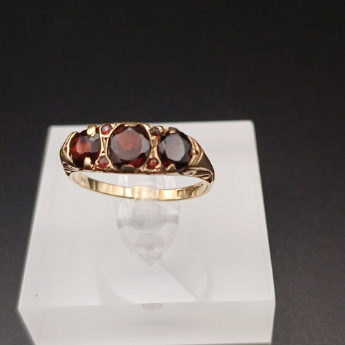 5 - Three Stone Garnet Ring with Four further Stones set in between.
- size P
- 1950's
- 9 ct yellow gol... 