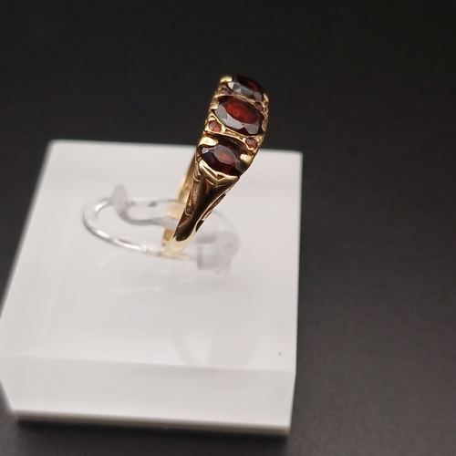 5 - Three Stone Garnet Ring with Four further Stones set in between.
- size P
- 1950's
- 9 ct yellow gol... 