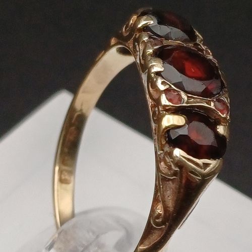 5 - Three Stone Garnet Ring with Four further Stones set in between.
- size P
- 1950's
- 9 ct yellow gol... 