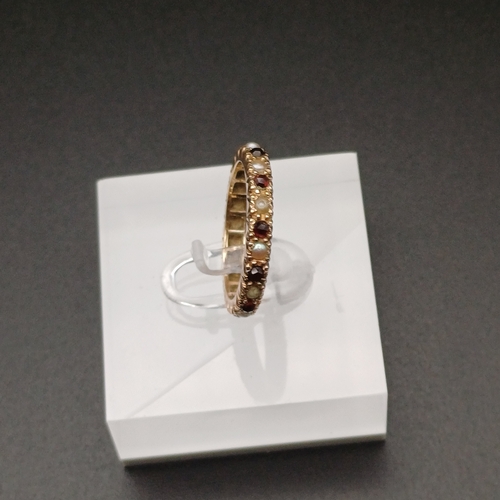 10 - Full Eternity Ring set with Garnet and Sea Pearls
- 9 ct yellow gold
- size M
- 2.7 g