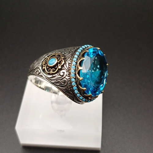 13 - Graduation Style Ottoman Gent's Ring with a Stunning Topaz Blue Stone and Turquoise set around.
- si... 