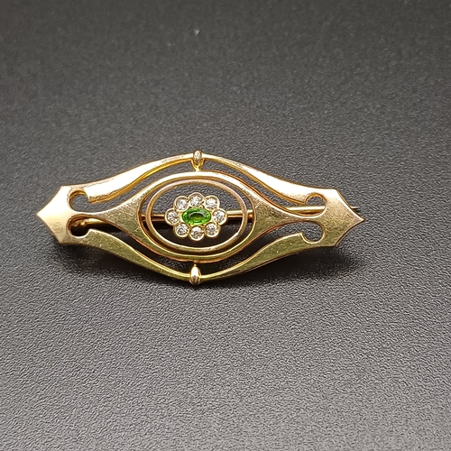 18 - Peridot and White Stone Pin Brooch set in a yellow colour metal
- 3.1 g