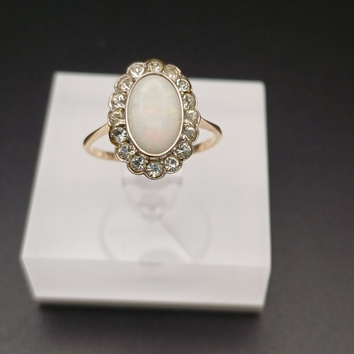 28 - Very Pretty Opal and White Stone Ring.  The Opal has lots of colour as you can see from the photos.
... 