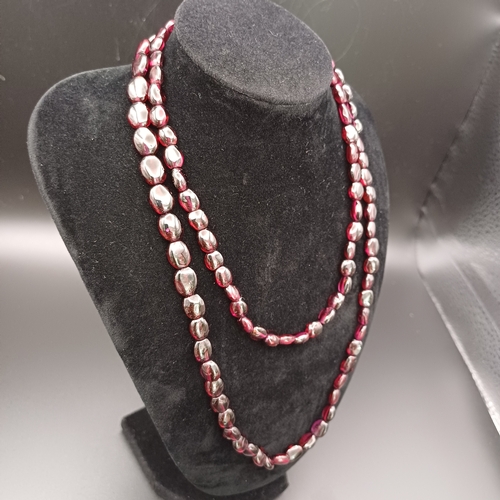 30 - This is a stunning Garnet Strung Necklace which measures 32 inches.  The Vendor had this re-strung a... 