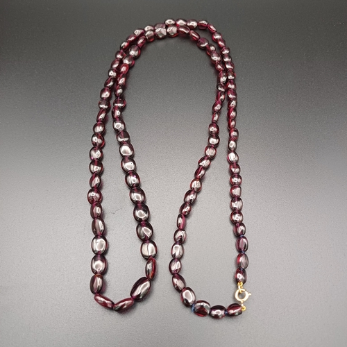 30 - This is a stunning Garnet Strung Necklace which measures 32 inches.  The Vendor had this re-strung a... 