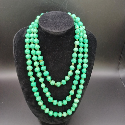 31 - Another stunning necklace of strung Jade Beads measuring 48 inches with a silver clasp and it weighs... 