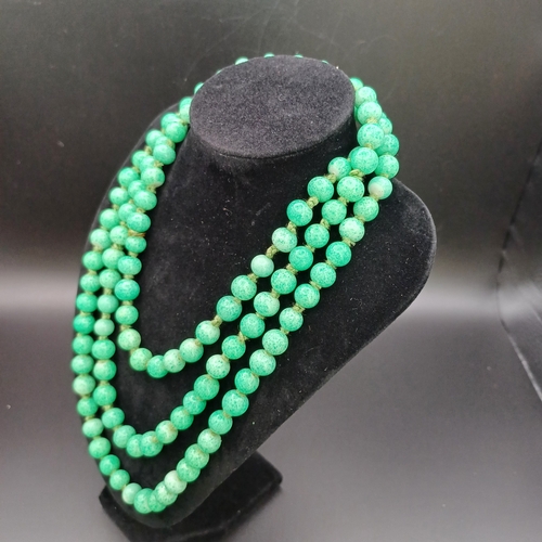 31 - Another stunning necklace of strung Jade Beads measuring 48 inches with a silver clasp and it weighs... 