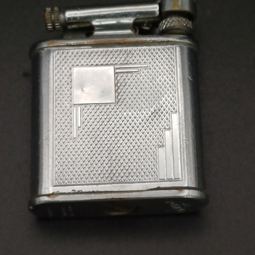 37 - A 1920's Cigarette Lighter weighing 40.3 g and you can see the marking of a Polo Player