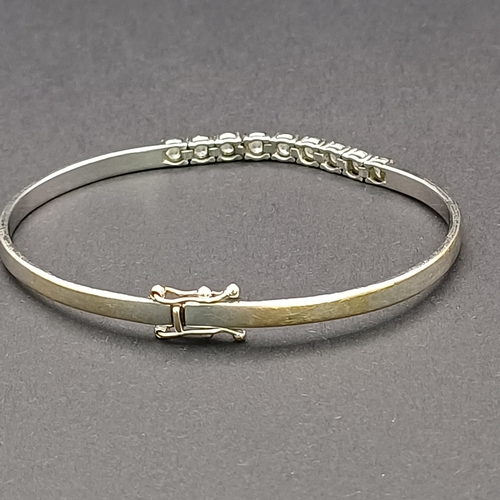 51 - And the sparkle continues with this really lovely Diamond Bangle. 
- 9 x diamonds
- 18 ct white gold... 