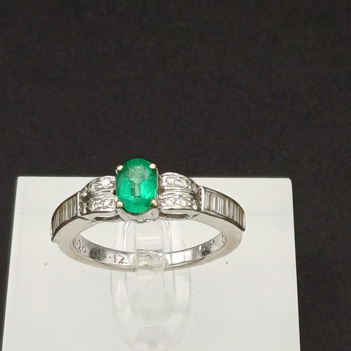 53 - This is such a beautiful coloured Emerald and enhanced by the round and baguette Diamonds set either... 