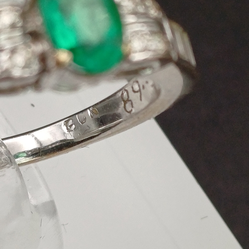 53 - This is such a beautiful coloured Emerald and enhanced by the round and baguette Diamonds set either... 