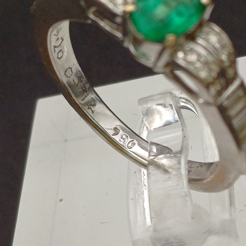 53 - This is such a beautiful coloured Emerald and enhanced by the round and baguette Diamonds set either... 