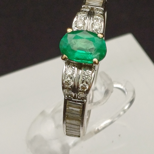 53 - This is such a beautiful coloured Emerald and enhanced by the round and baguette Diamonds set either... 