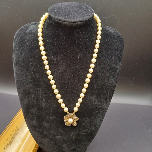 57 - Antique Single String Strand of Pearls with a Flower Pendant from Ciro of Bond Street. 
- length/dro... 