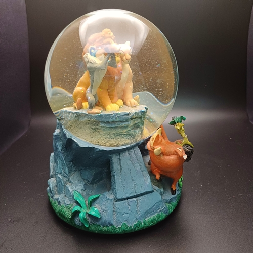 31 - Disney's 'Lion King' snow globe sitting on 'Pride Rock' which is also a music box playing 'Circle of... 