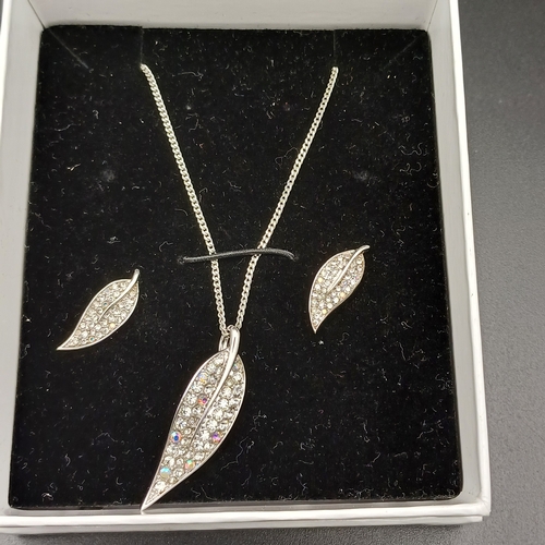 57 - Martin James Necklace and Earring Set in Silver Colour Metal with a leaf design set with small cryst... 