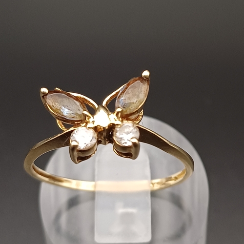 110 - White and Smoky Stone Ring in a Butterfly Setting.
- 9 ct
- size Q
 - weight 2.0 g