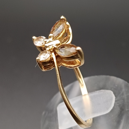 110 - White and Smoky Stone Ring in a Butterfly Setting.
- 9 ct
- size Q
 - weight 2.0 g
