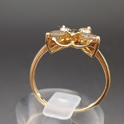 110 - White and Smoky Stone Ring in a Butterfly Setting.
- 9 ct
- size Q
 - weight 2.0 g