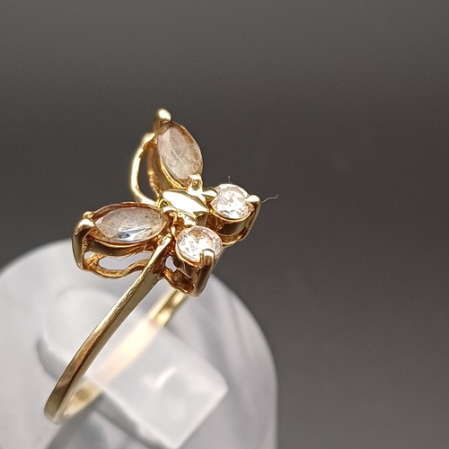 110 - White and Smoky Stone Ring in a Butterfly Setting.
- 9 ct
- size Q
 - weight 2.0 g