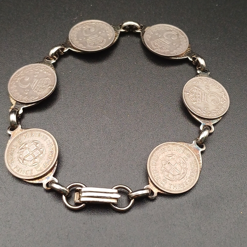 126 - Here we have old Three Pence Coins being converted into a bracelet.  The coins range from 1916 to 19... 