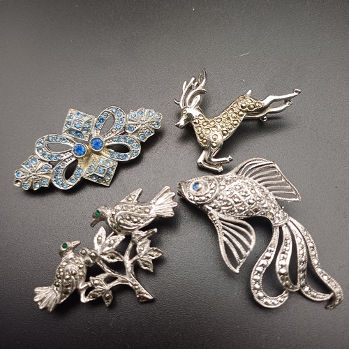 131 - This lot has four Marcasite Brooches:
1 x Two birds facing each other
1 x Fish
1 x Deer
1 x Blue sto... 