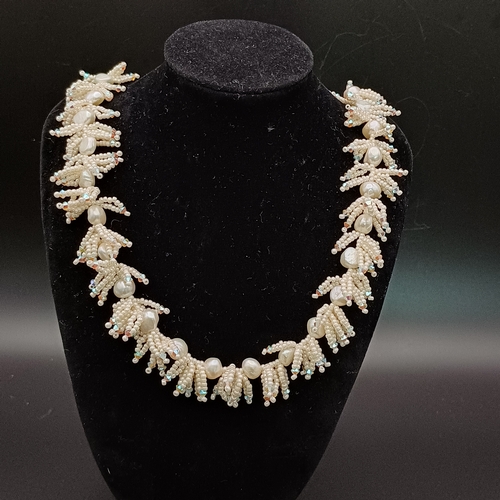 10 - This is an unusual Natural Pearl Necklace with other beads set in.  It is quite striking when on.