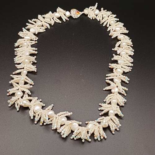 10 - This is an unusual Natural Pearl Necklace with other beads set in.  It is quite striking when on.