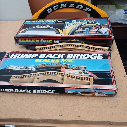 37 - Scalextric Extras in their original boxes:
1 x Hump Back Bridge
1 x Dunlop Bridge