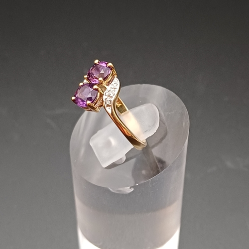 28 - Two Stone Amethyst and Diamond Ring in a very pretty setting.
- size J/ K
- weight 1.5 g
- 9 ct