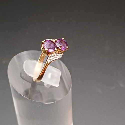 28 - Two Stone Amethyst and Diamond Ring in a very pretty setting.
- size J/ K
- weight 1.5 g
- 9 ct