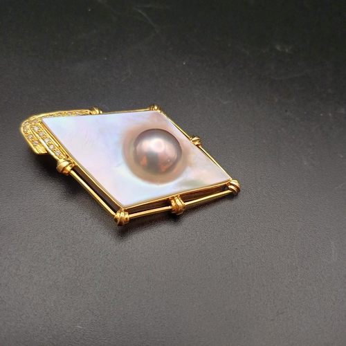 32 - Stunning Mother of Pearl and Diamond Pendant, with a Pearl actually capsulated.
- 14 ct
- weight 16.... 