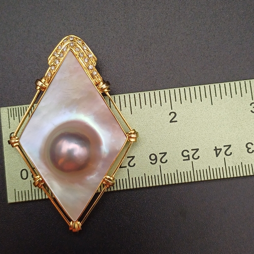 32 - Stunning Mother of Pearl and Diamond Pendant, with a Pearl actually capsulated.
- 14 ct
- weight 16.... 