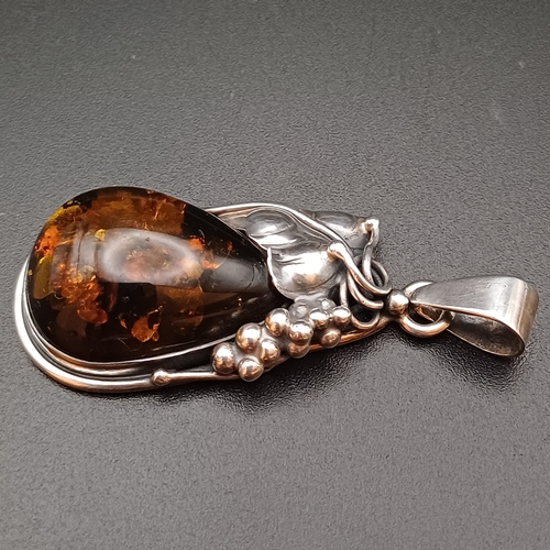 34 - A very Beautiful Amber Pendant set in 925 Silver with leaf and grape design.  The pendant is 2 inche... 